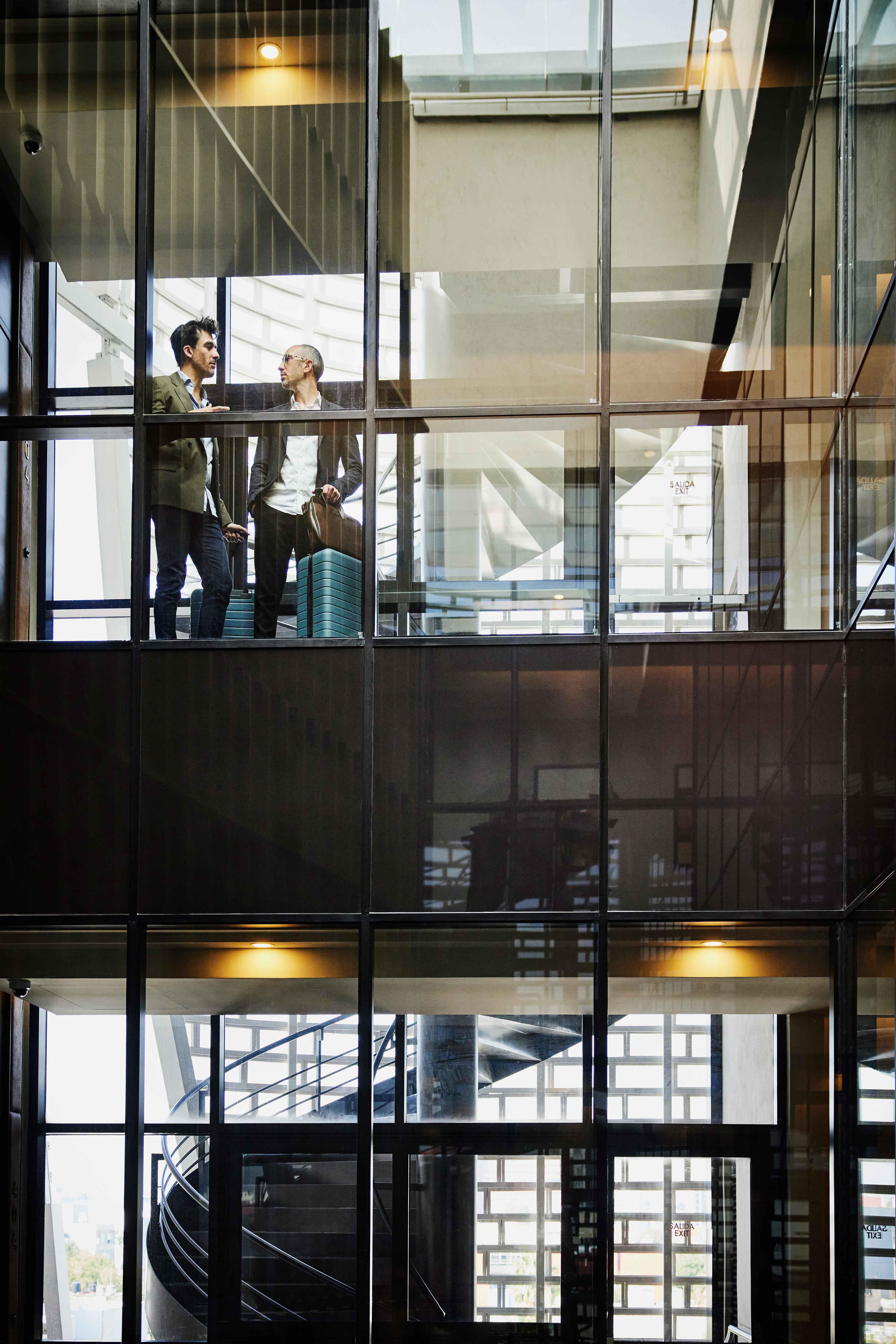 two people talking in an office space